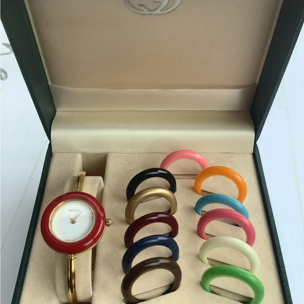 Gucci Women’s Gold Bangle Watch with Interchangeable Color Bezels